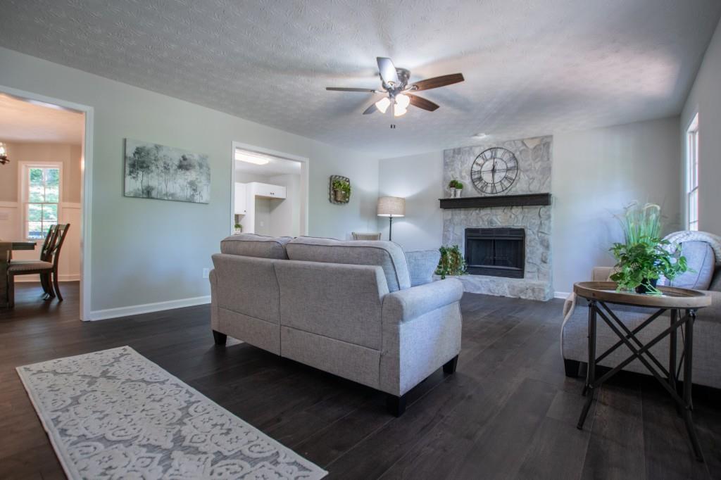 a living room with furniture and a fireplace