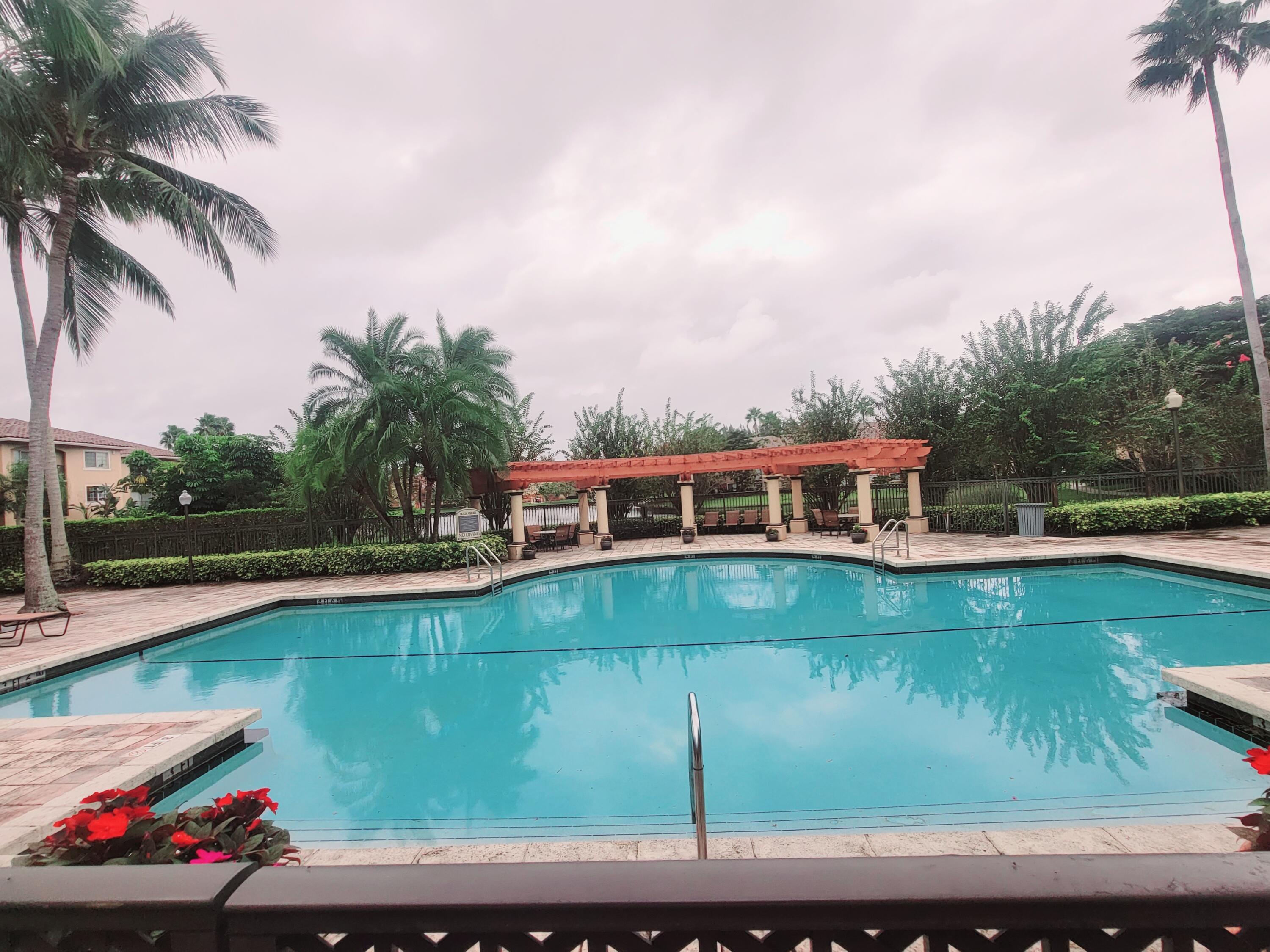 a view of a swimming pool with a patio