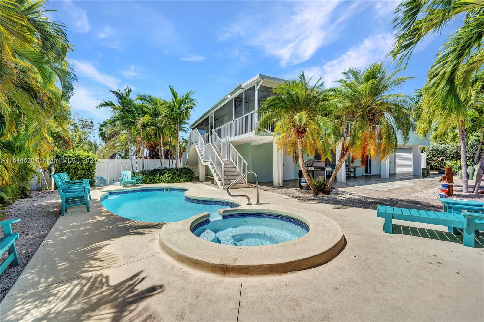 a swimming pool with outdoor seating