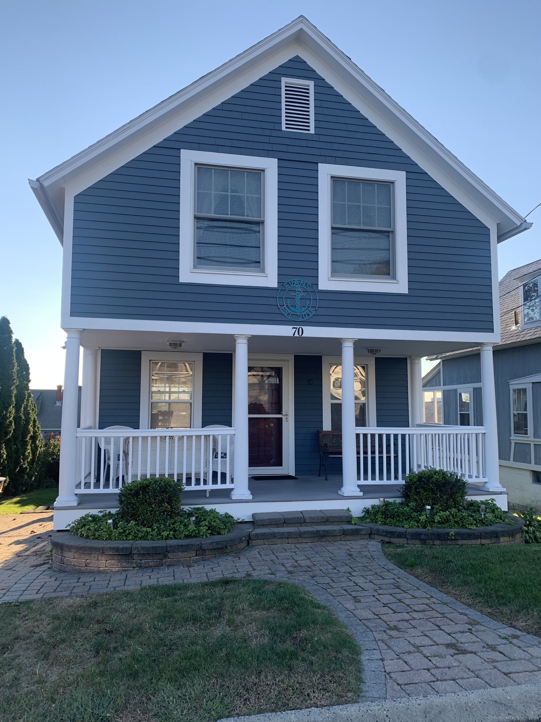 a front view of a house with garden