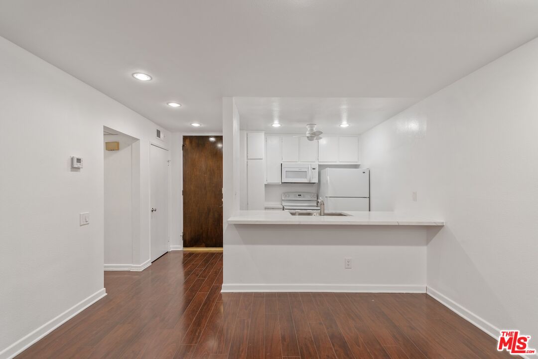 a view of kitchen with wooden floor