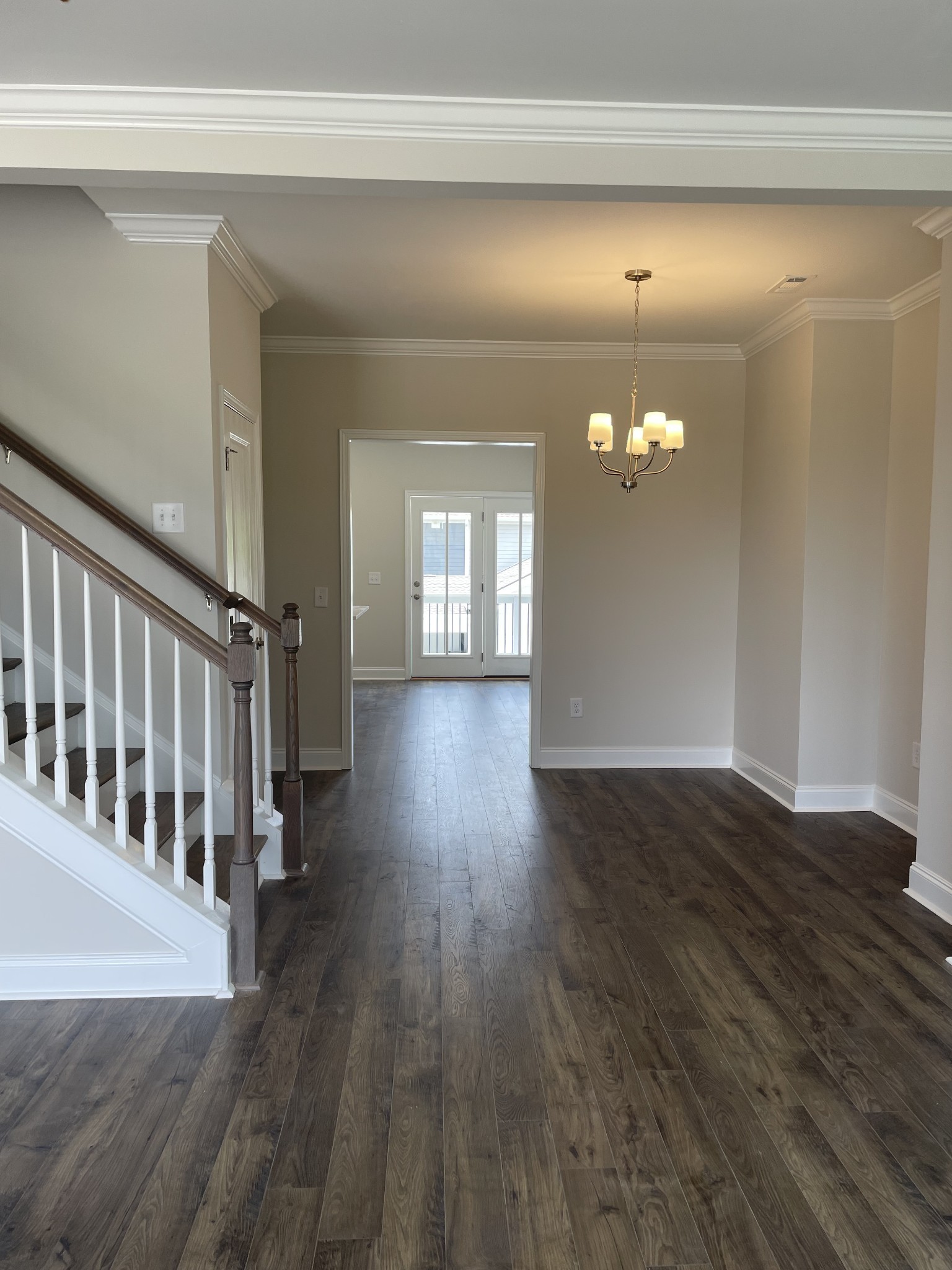 a view of a livingroom with wooden floor