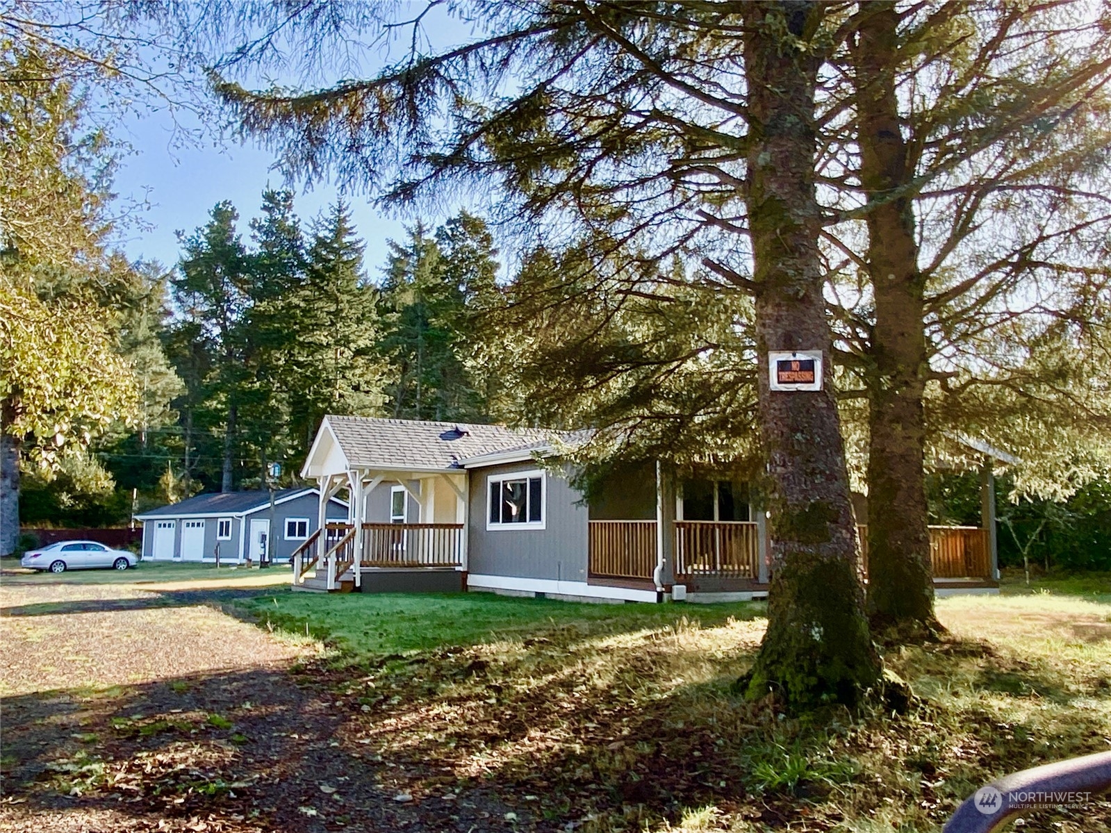 a view of a house with yard and a tree