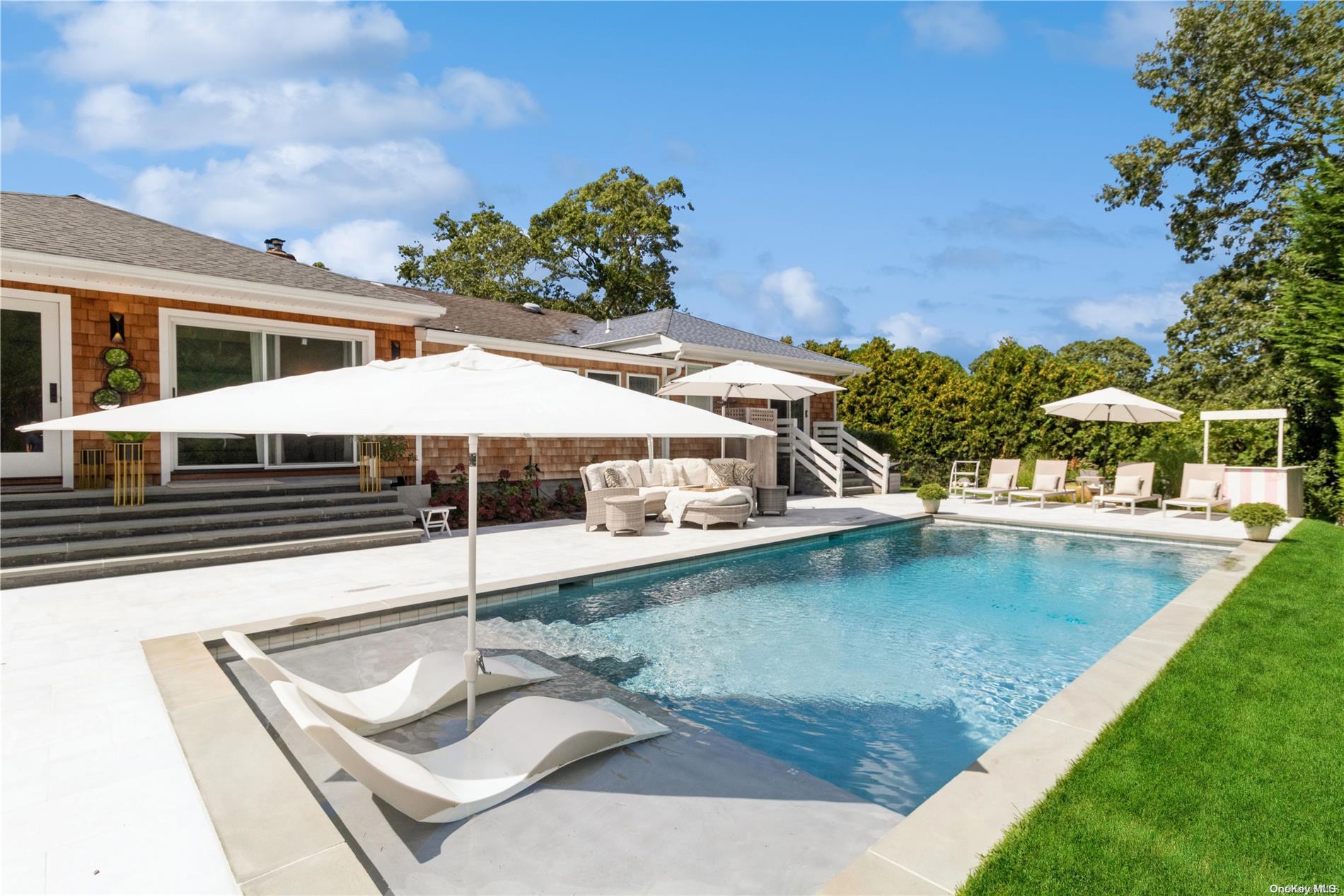 swimming pool with outdoor seating