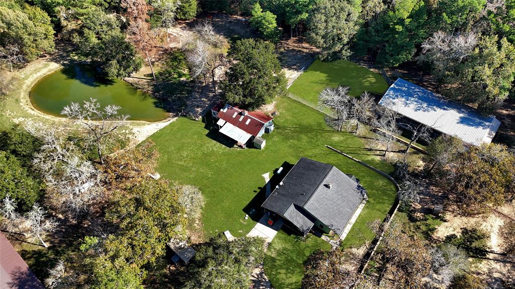 an aerial view of a house with a garden