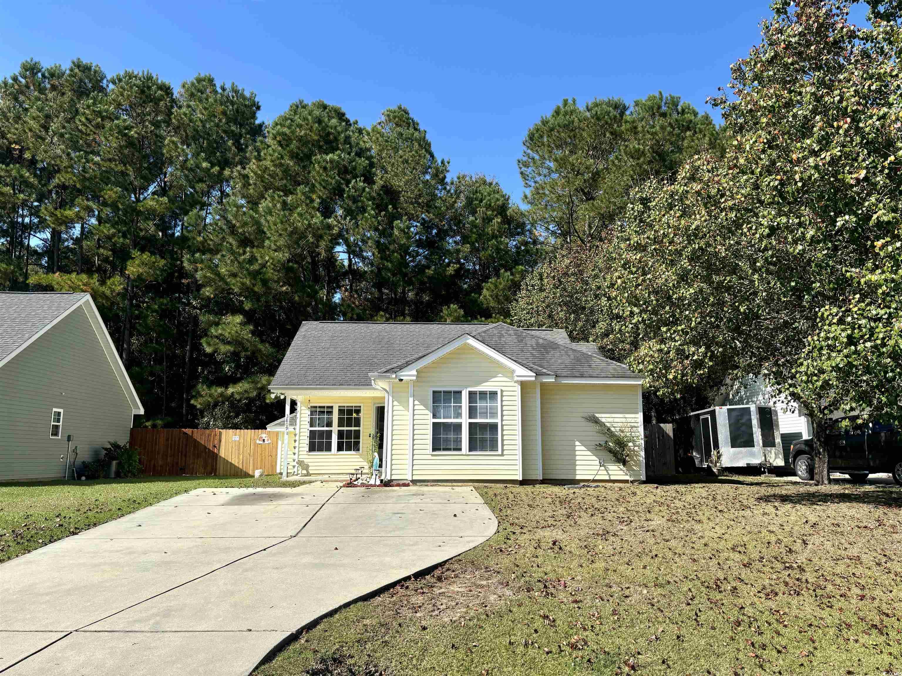 Ranch-style home with a front yard