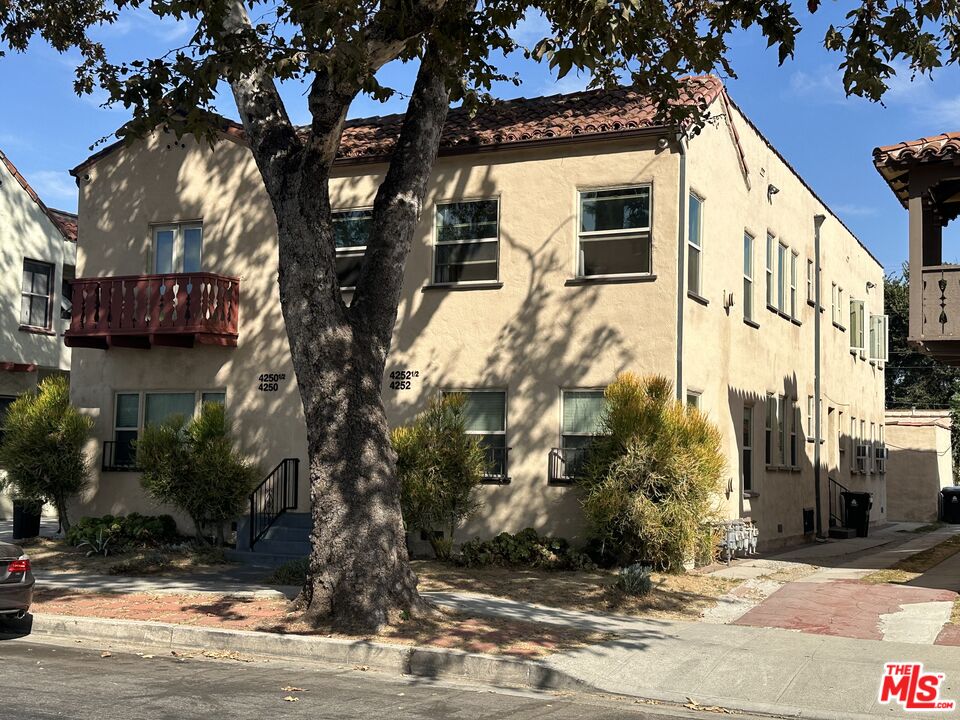 a front view of a building with street view