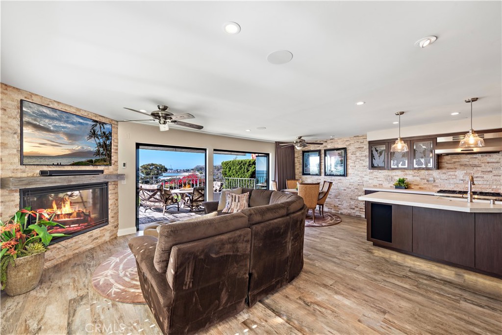 a living room with fireplace furniture and a flat screen tv