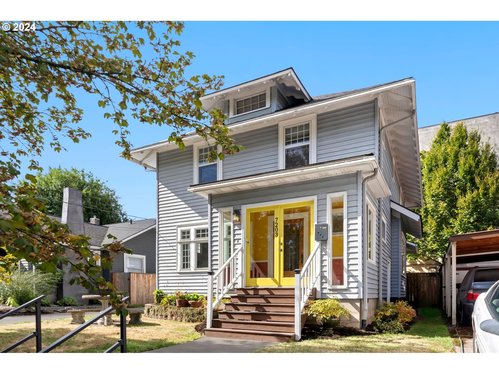 a front view of a house with garden