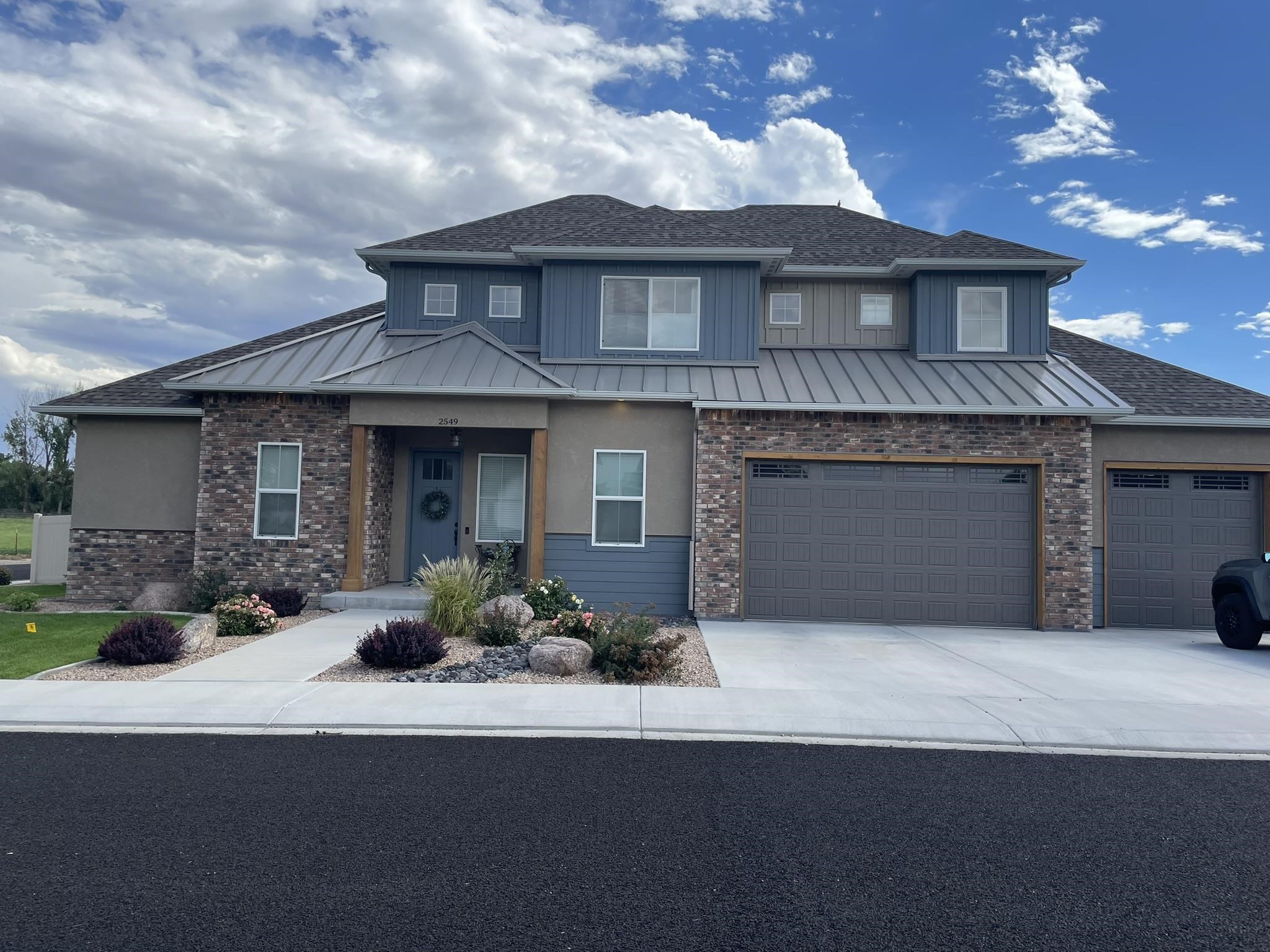 a front view of a house with yard