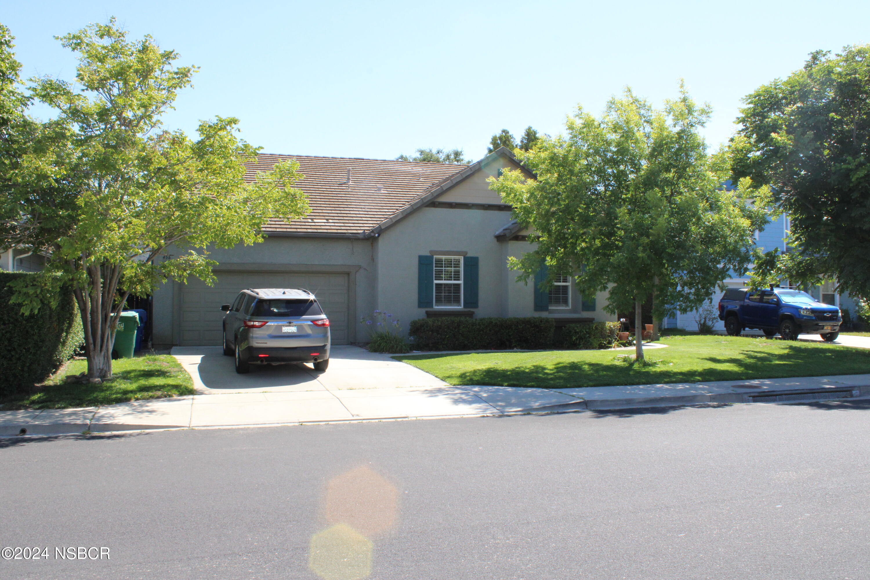 a house view with a garden space