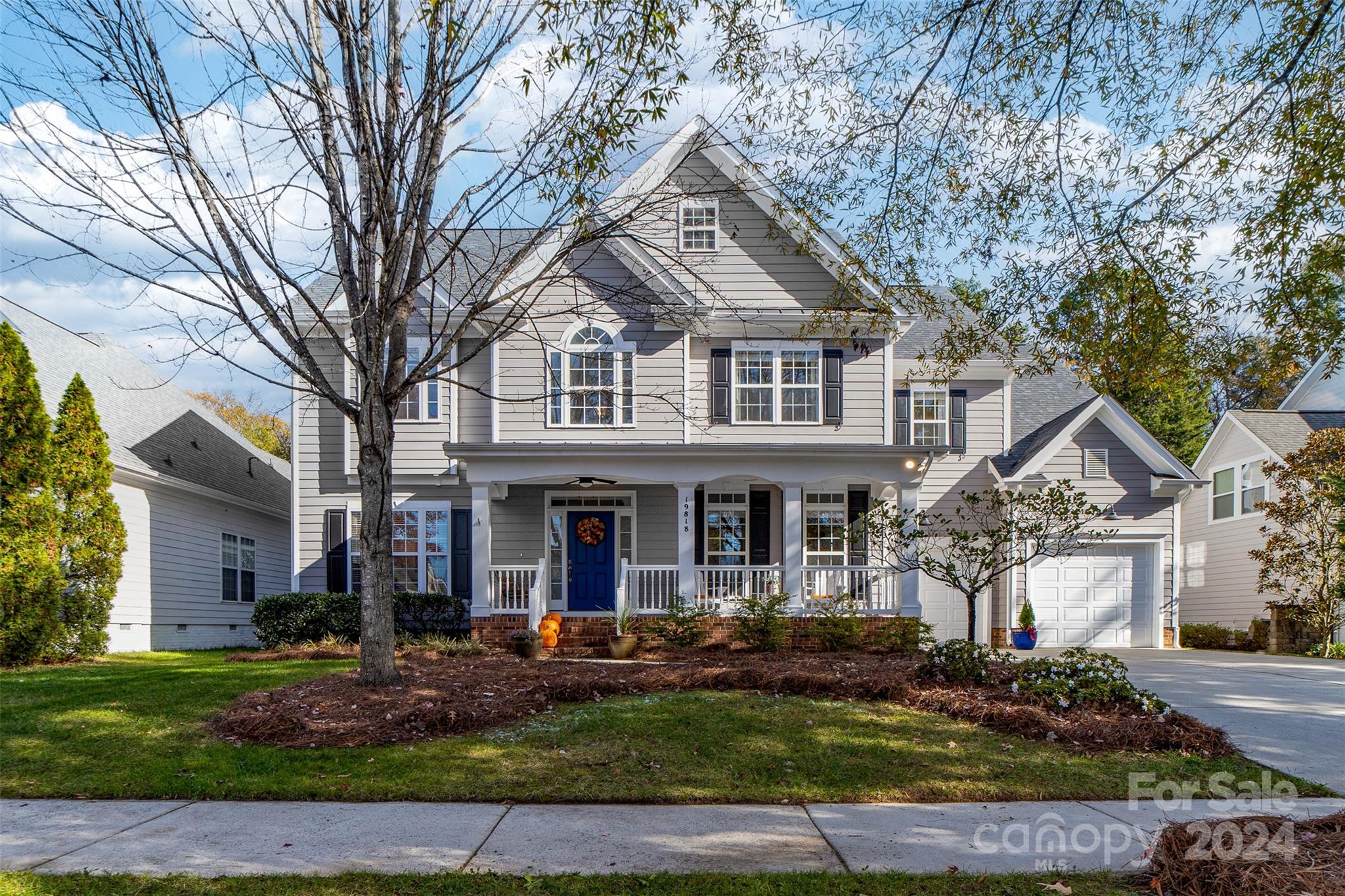 front view of a house with a yard