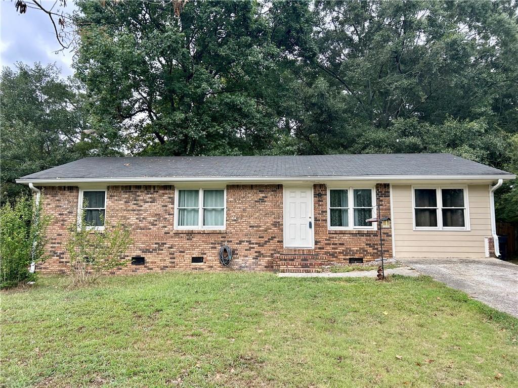 front view of a house with a yard