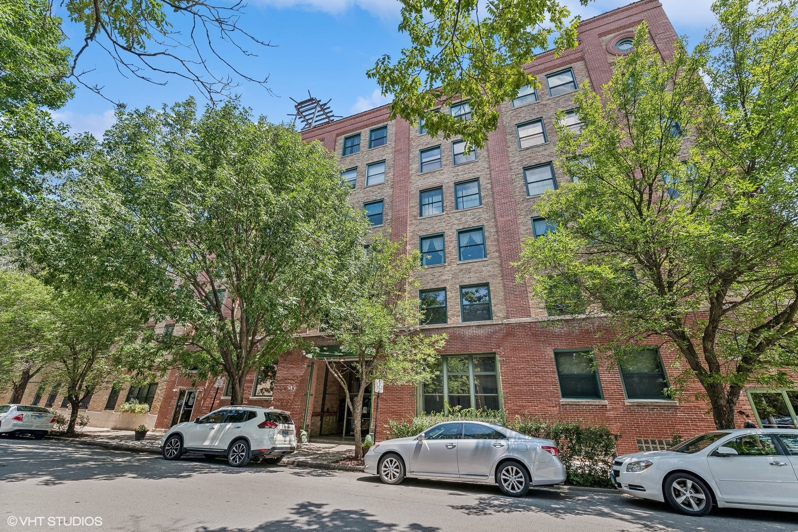 a view of a cars parked in front of a building