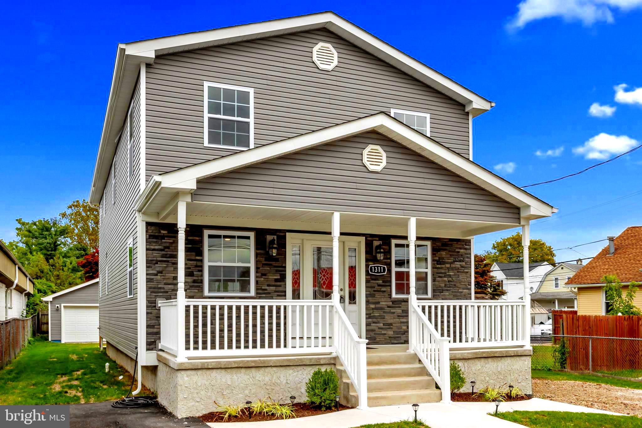 a front view of a house with a porch