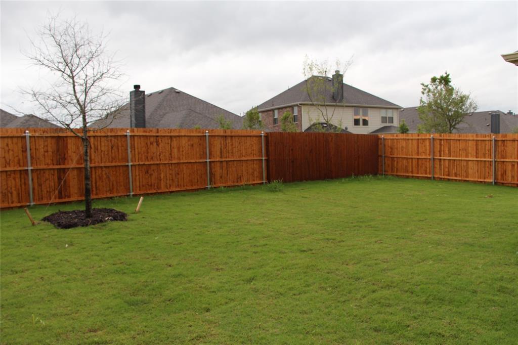 a view of a green house with a yard