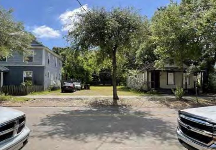 a house with trees in the background