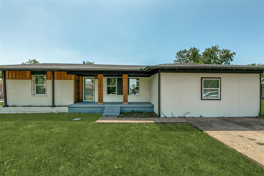 front view of a house with a yard