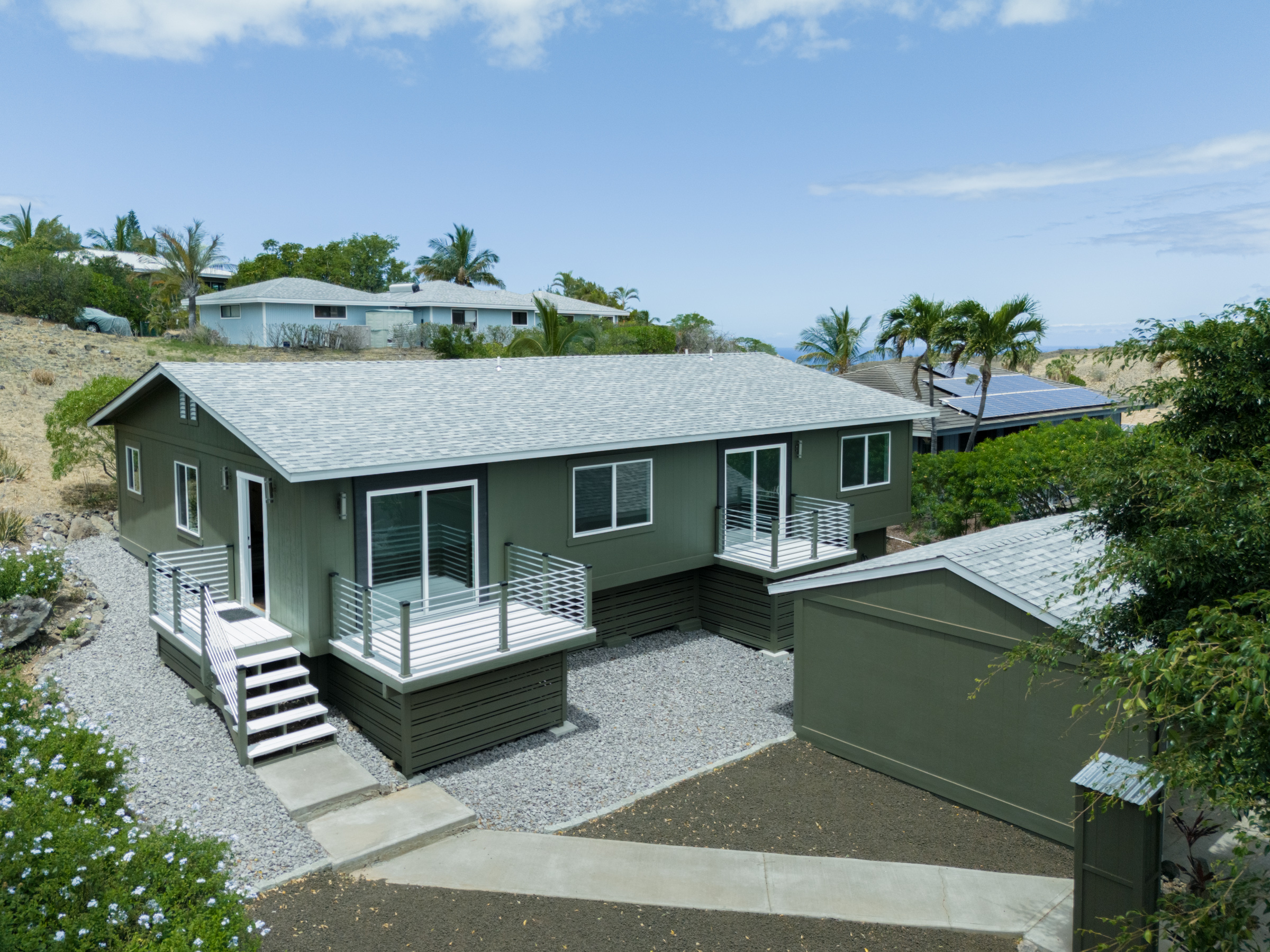 an aerial view of a house with a garden