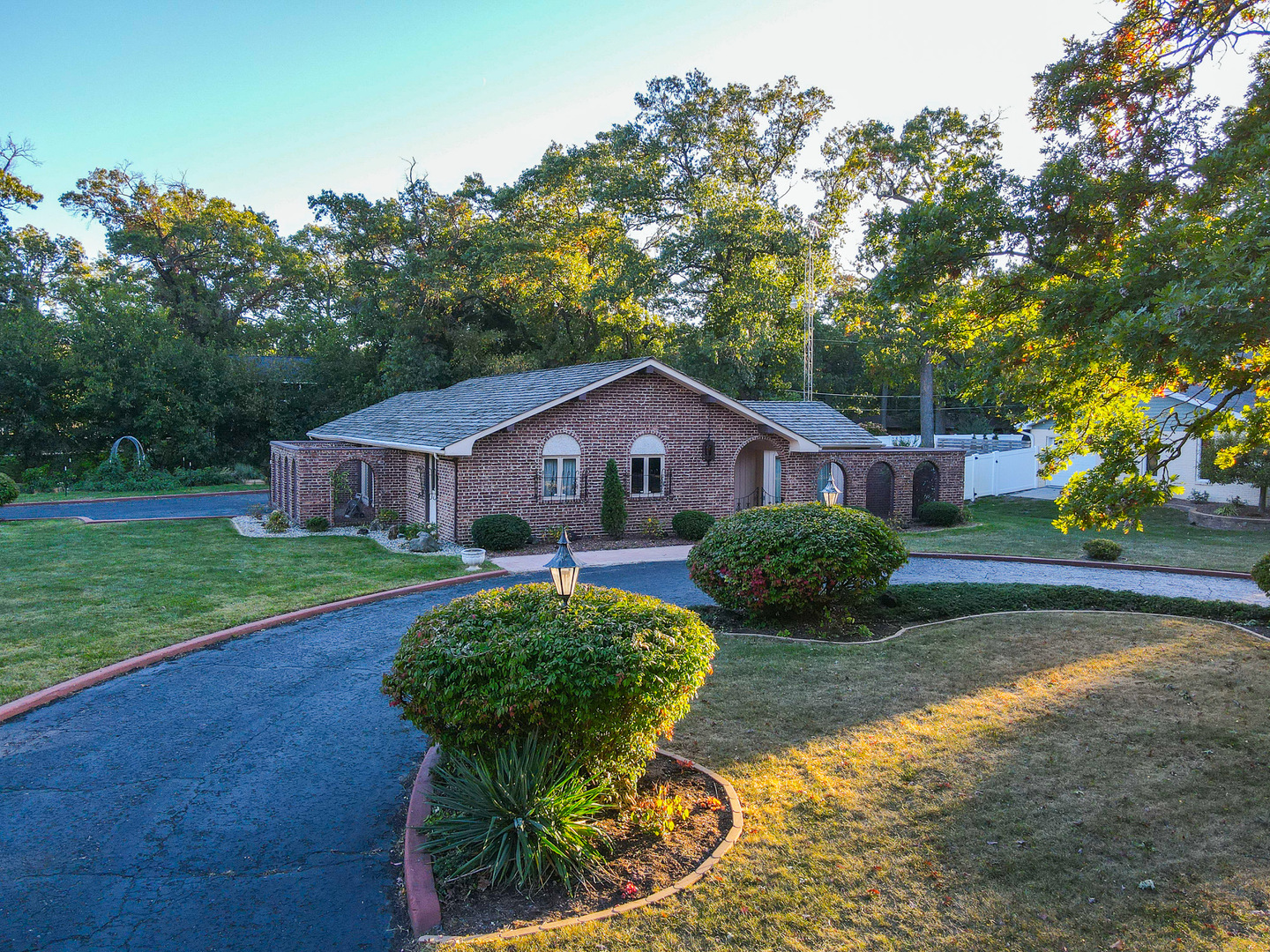 a front view of house with yard and green space