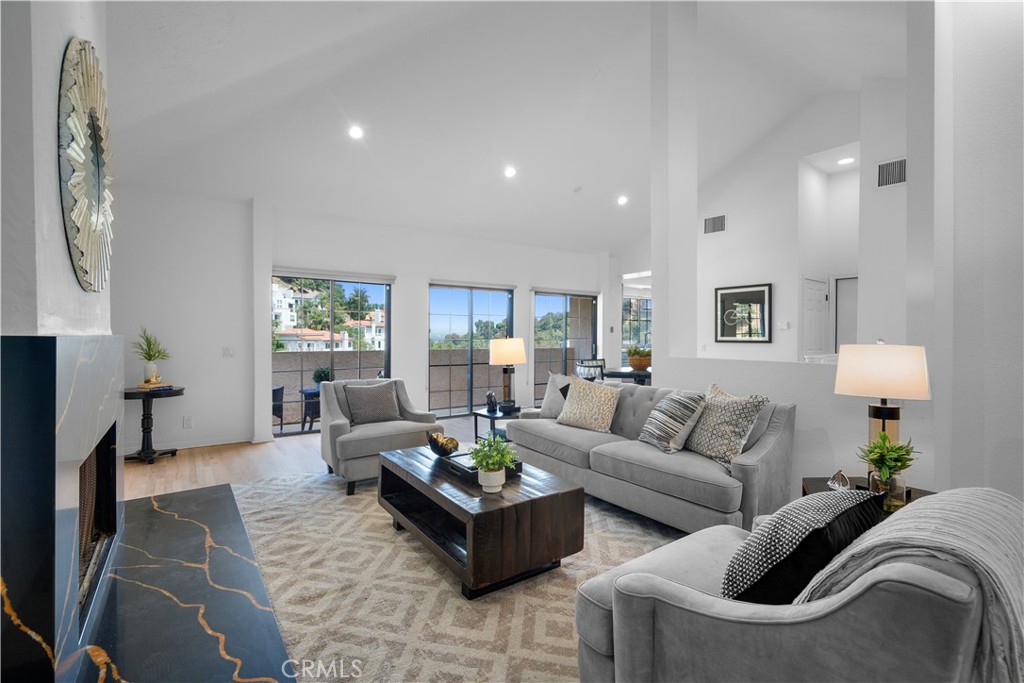 a living room with furniture and a lamp