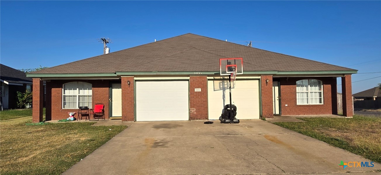 a front view of house with outdoor seating