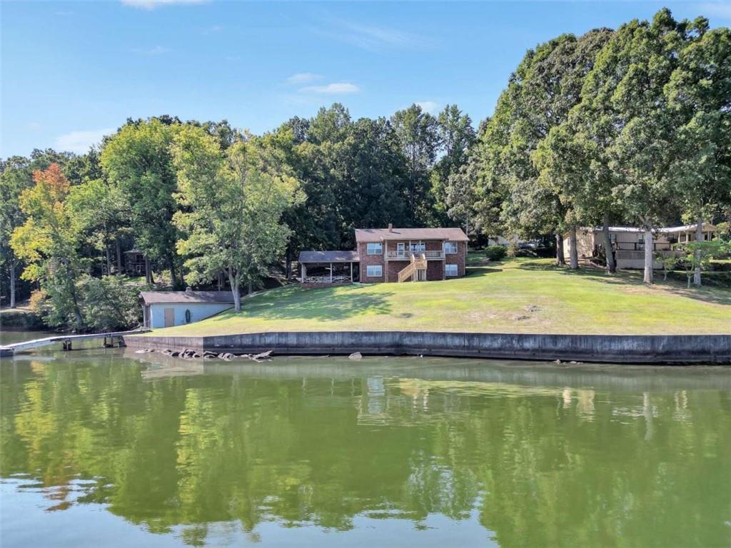 a view of a swimming pool with a yard