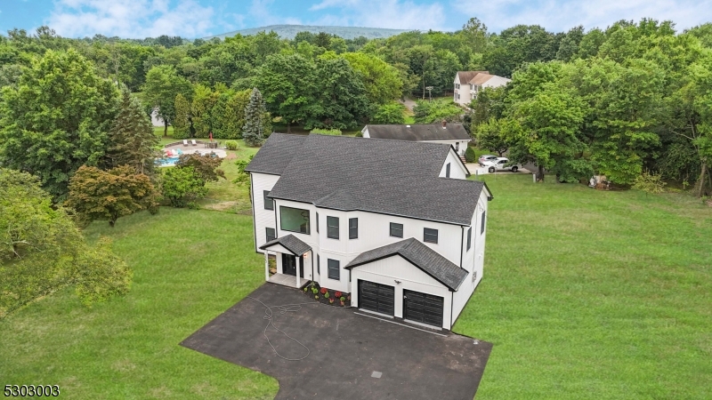 an aerial view of residential house with outdoor space