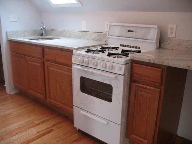 a kitchen with a stove and a sink