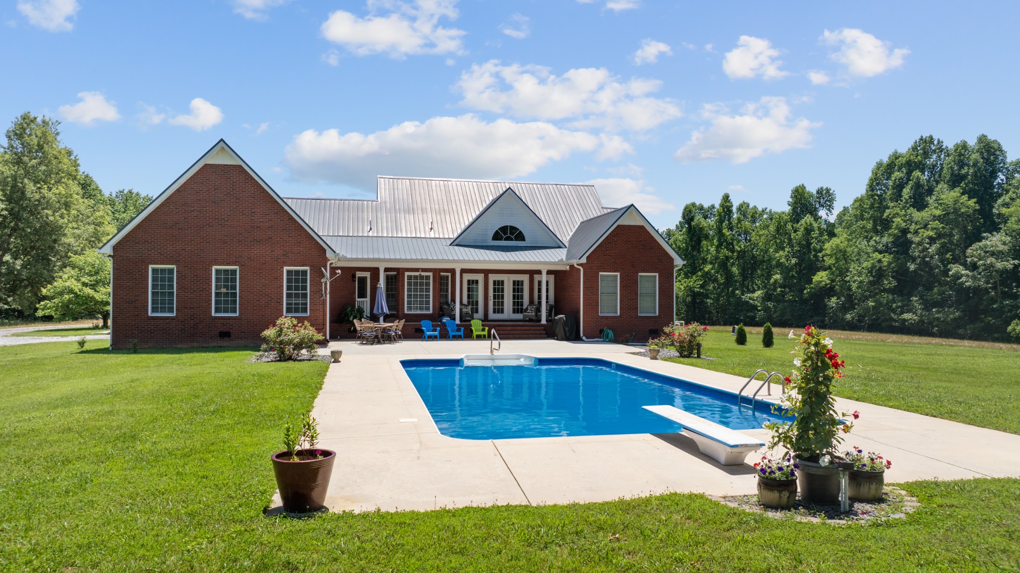 a view of a house with a yard porch and sitting area