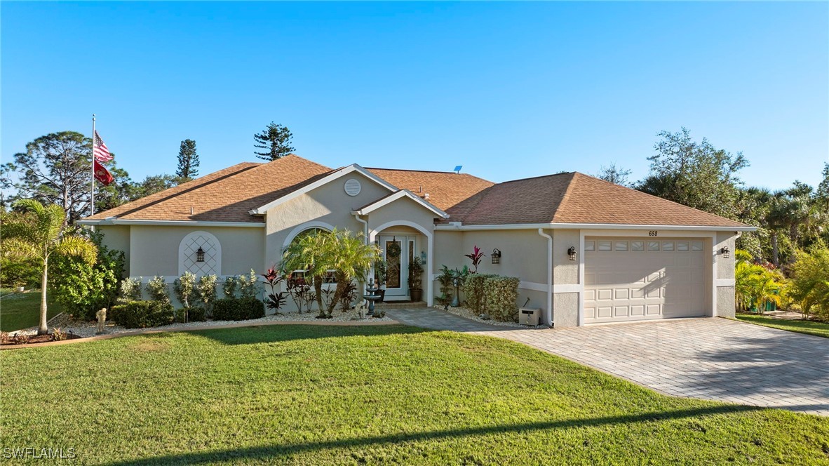 a front view of a house with garden