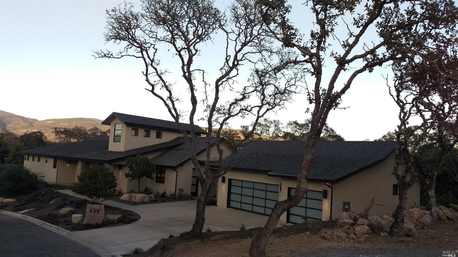 a front view of house with yard and seating space