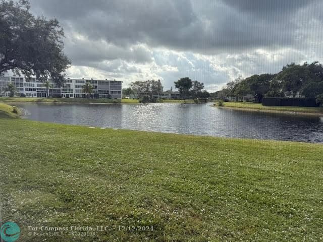 a view of a lake with houses in the background