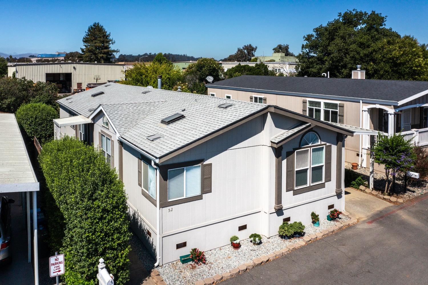 an aerial view of a house with yard