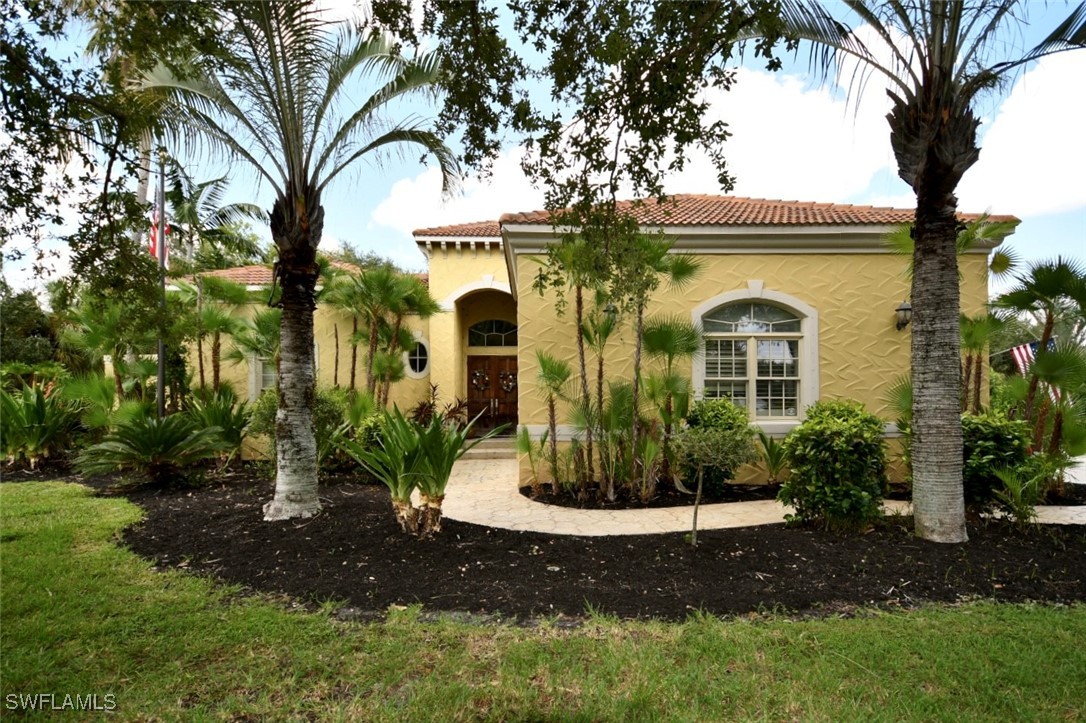 a front view of a house with garden