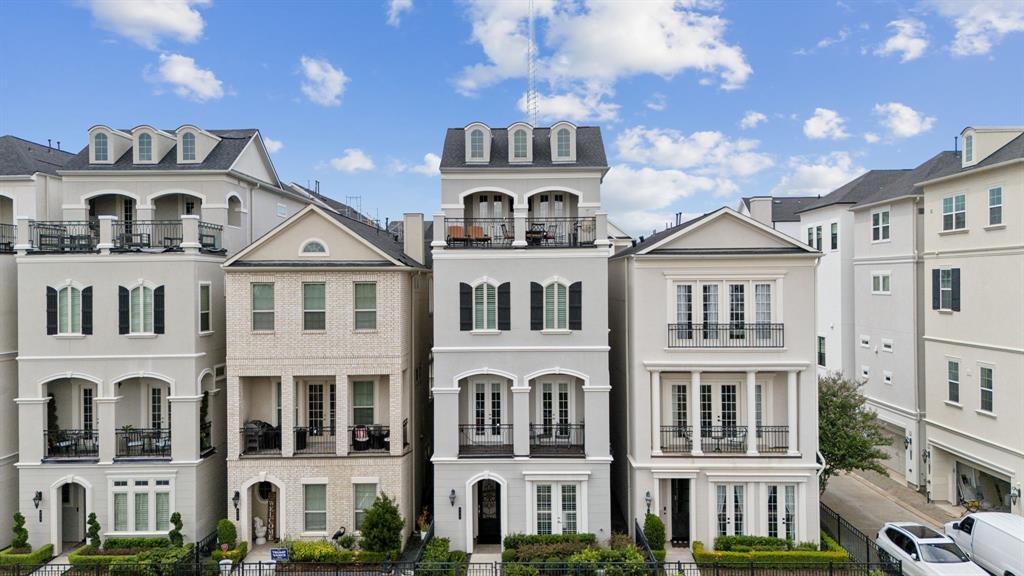 This 4 story home satisfies with both neighboring homes at 3 levels, allowing privacy and unobstructed views of the top floor grand balcony!