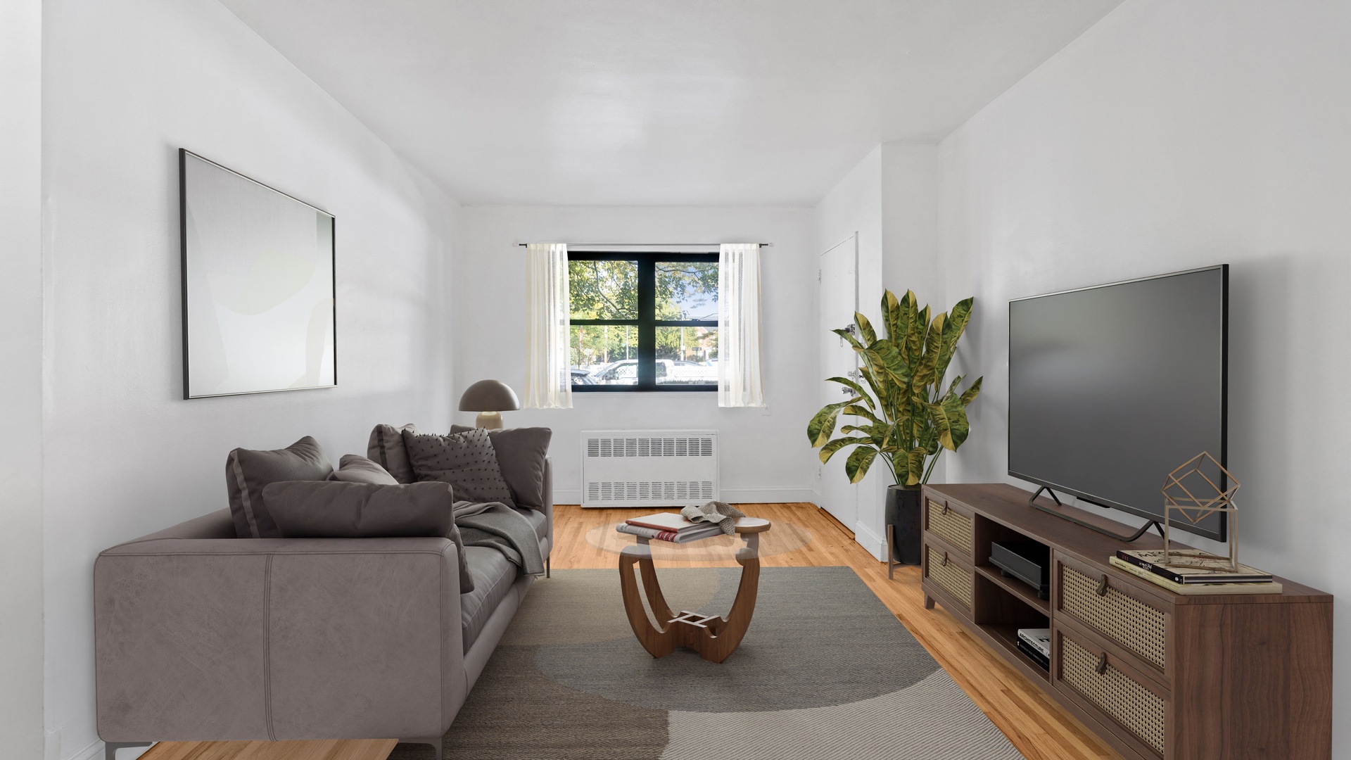 a living room with furniture a flat screen tv and a fireplace