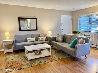 a living room with furniture and a rug