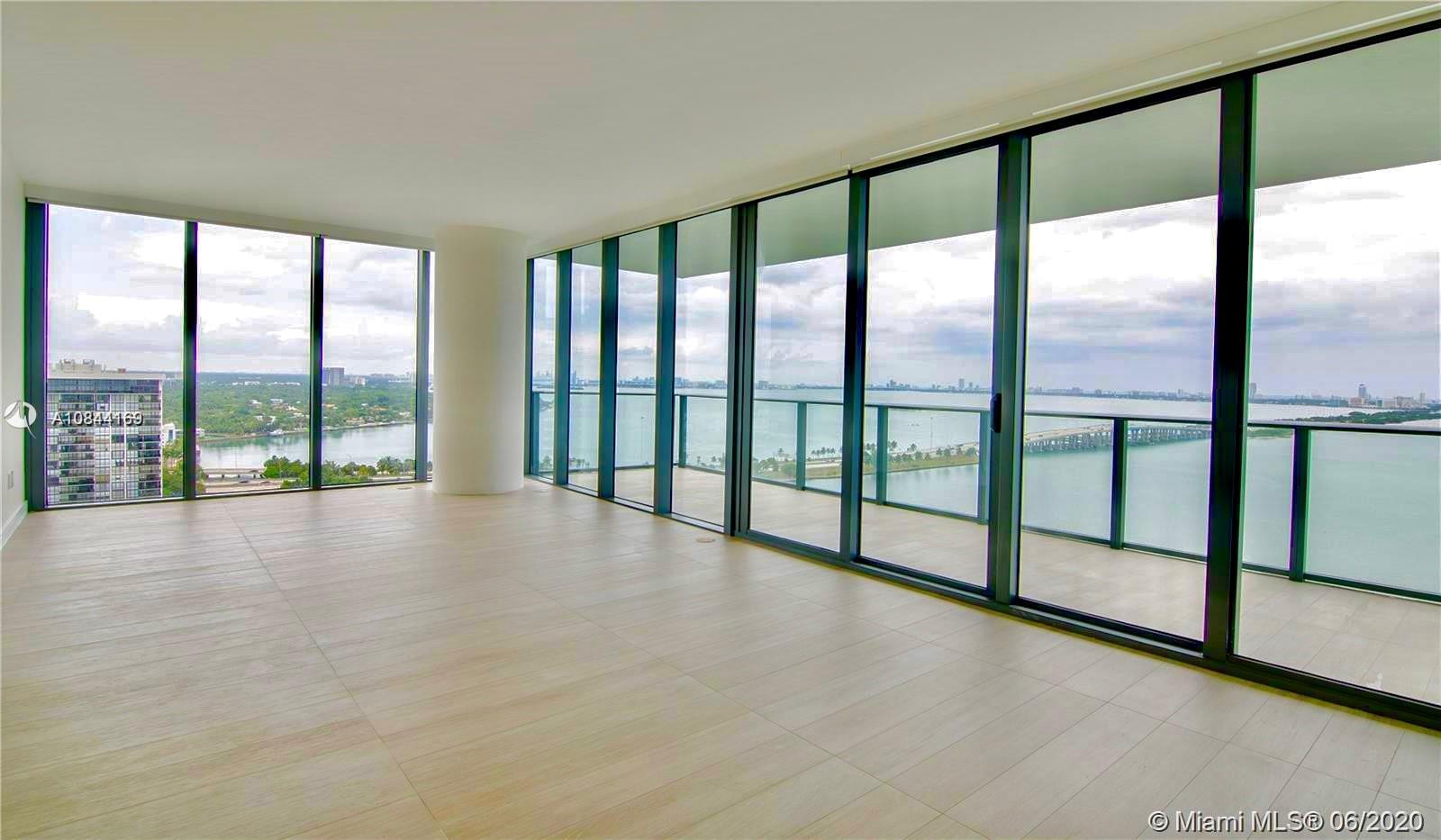 a view of an empty room with a large window