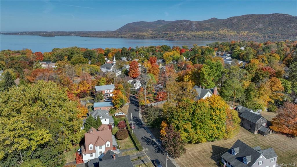 Aerial view featuring a water and mountain view