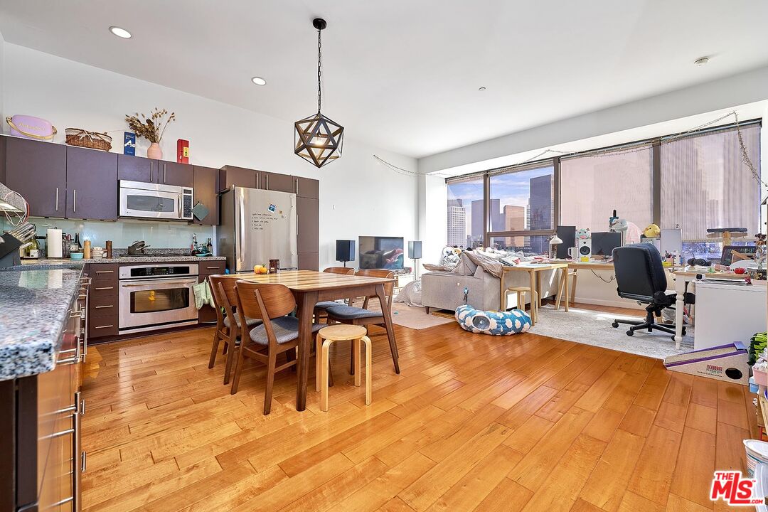 a view of a dining room with furniture window and outside view