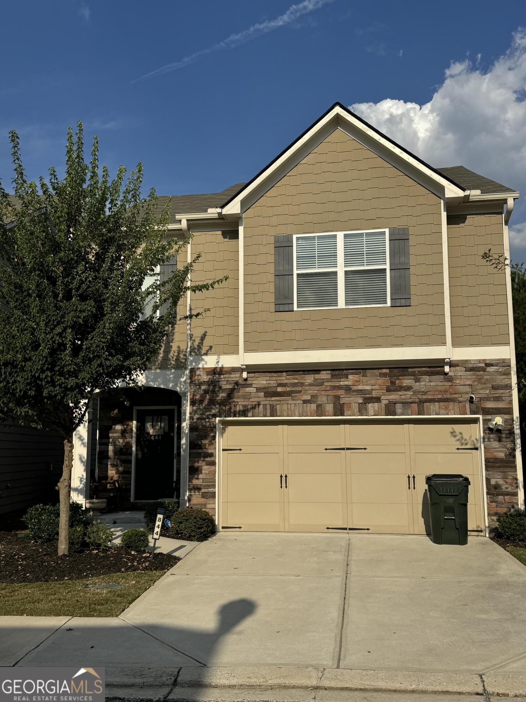 a front view of a house with yard