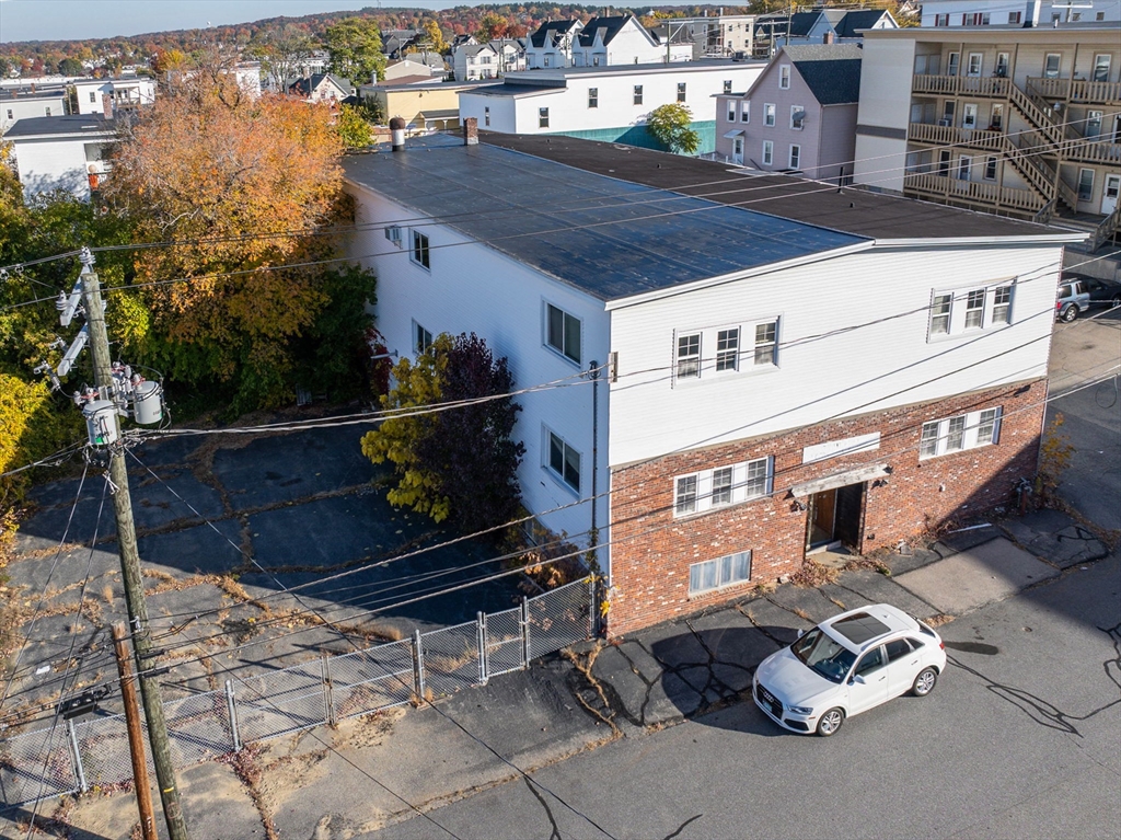 a front view of a house with parking space