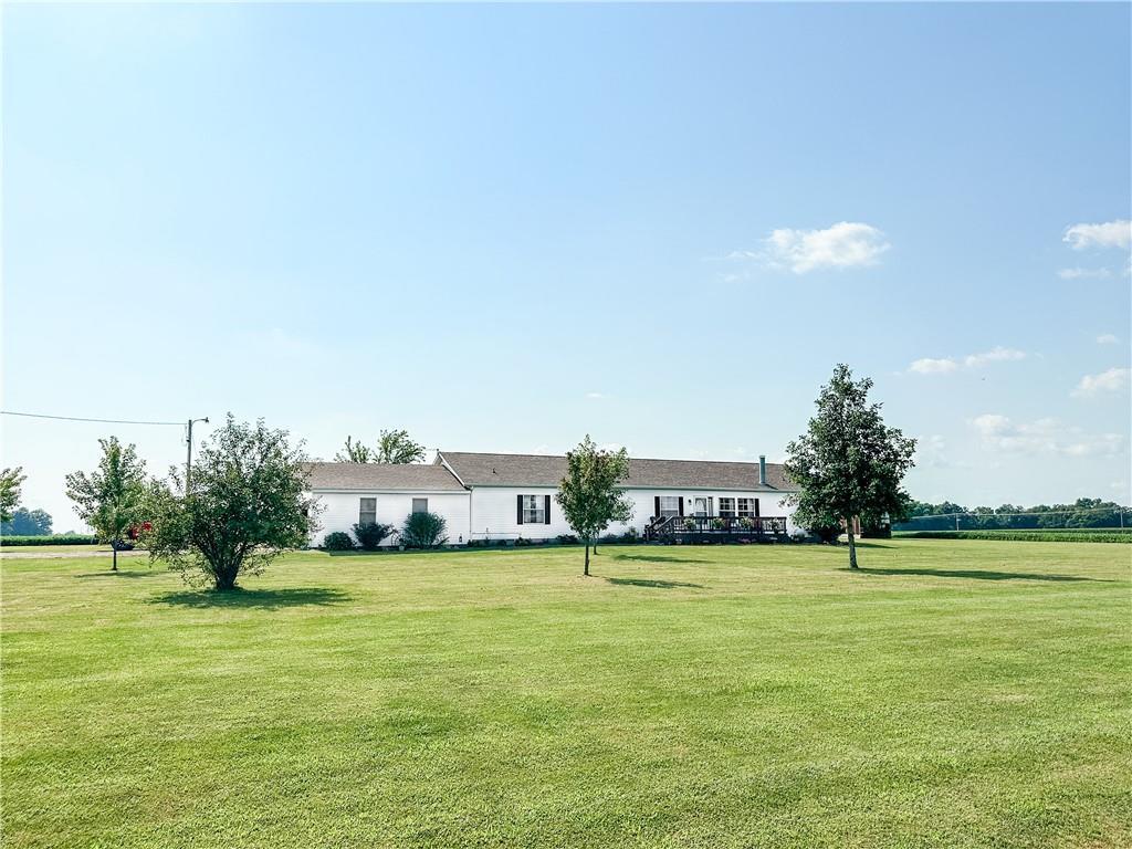 a view of a house with a big yard