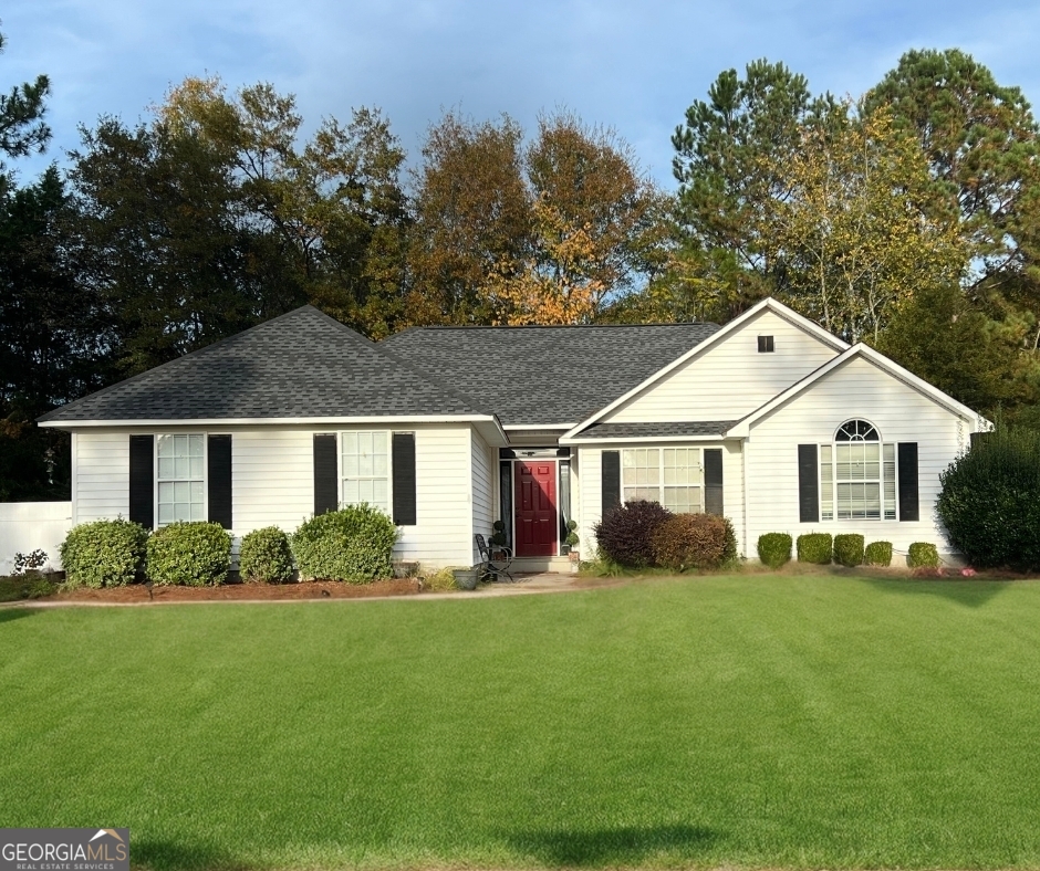 a front view of a house with a yard