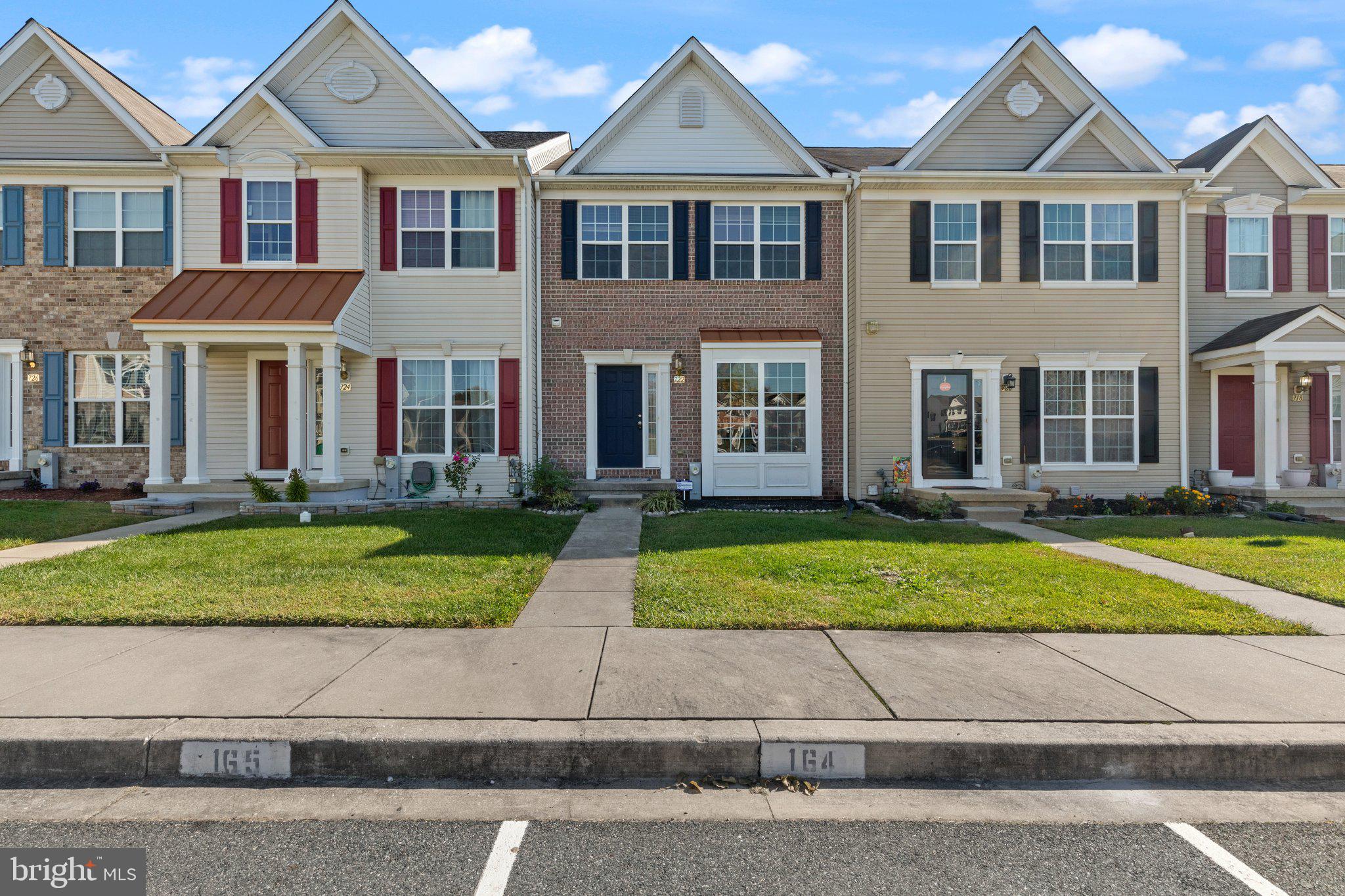 front view of a house next to a yard