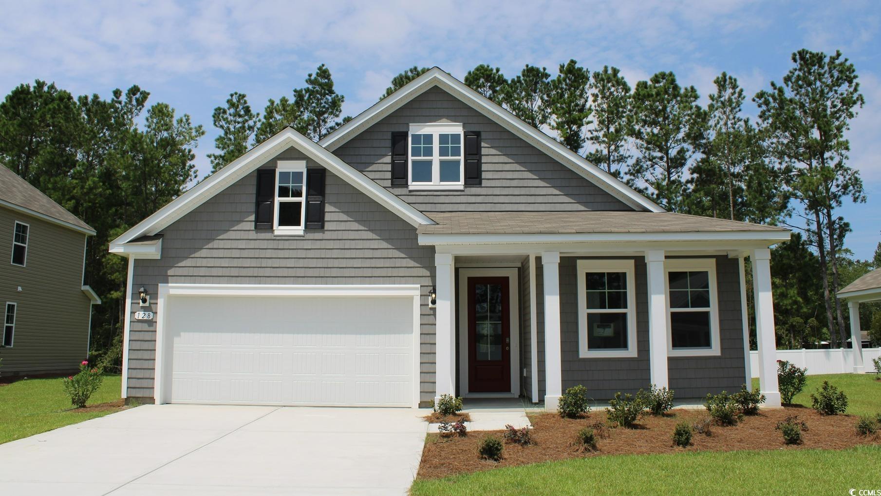 View of front of property with a garage