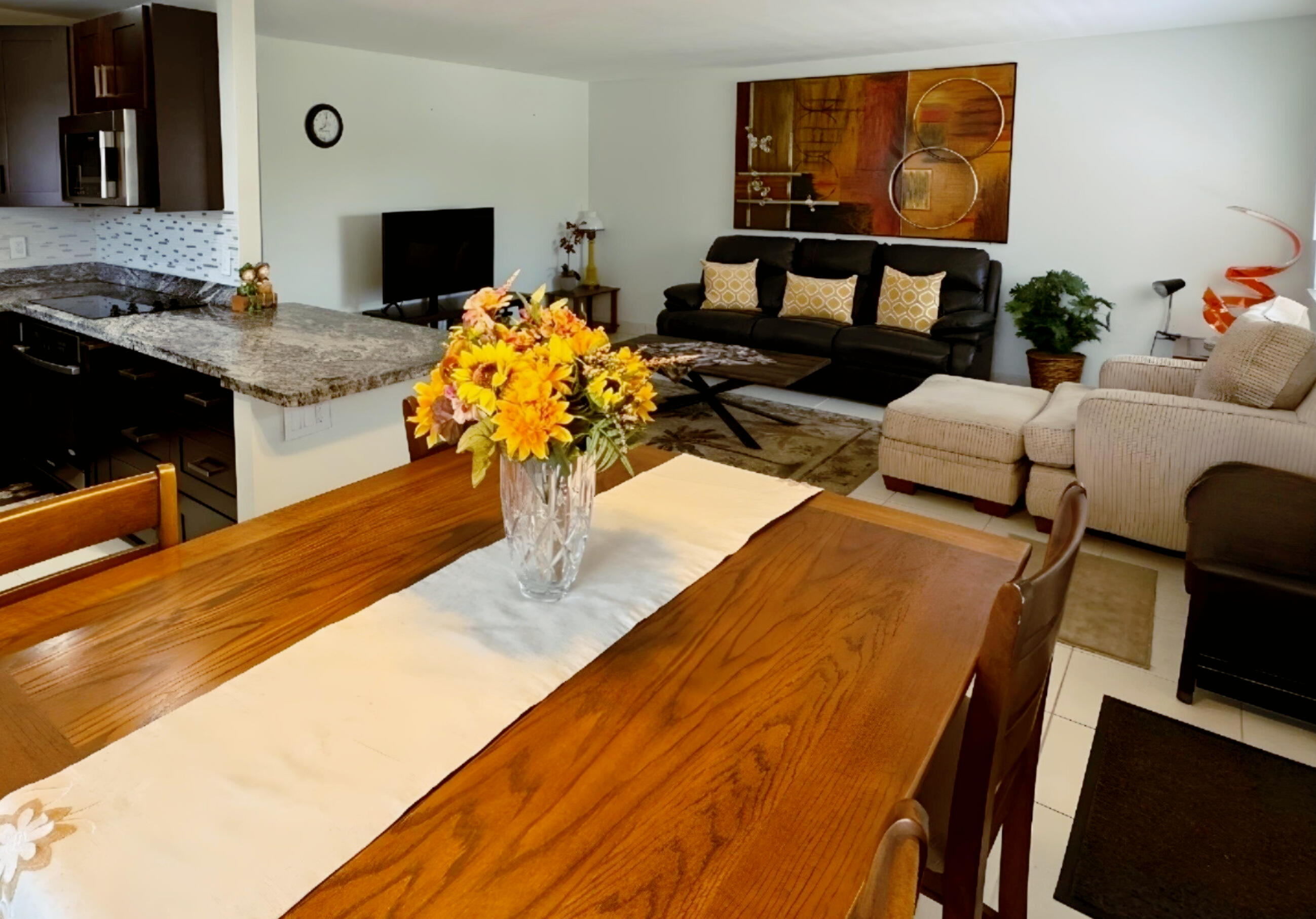 a living room with furniture and flat screen tv