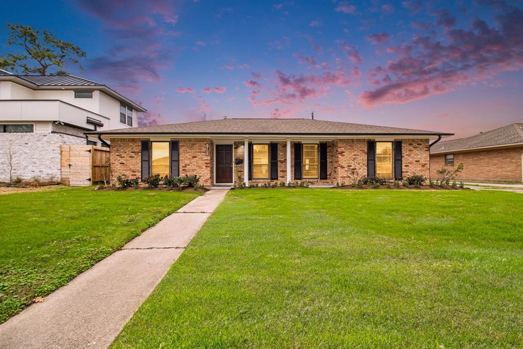 a front view of house with garden