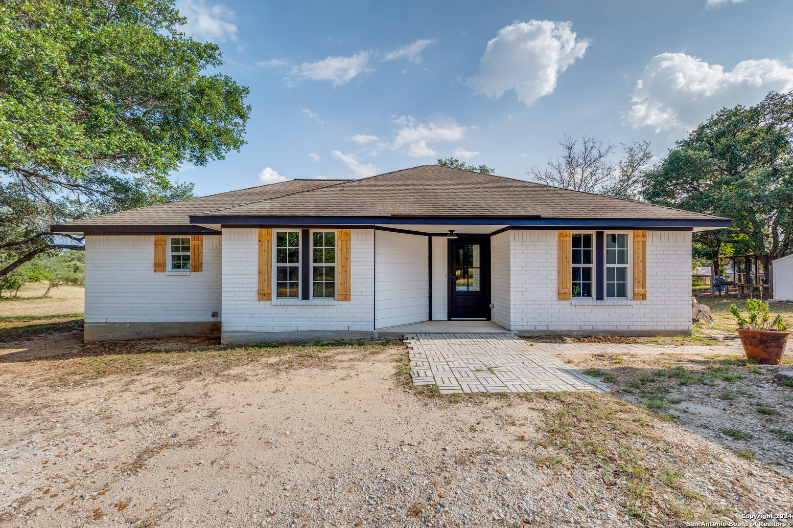 front view of a house with a dry yard